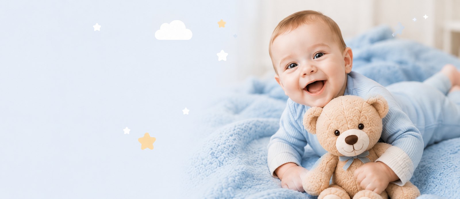Smiling baby in a blue onesie holding a teddy bear on a soft blue bed surrounded by pastel stars and clouds